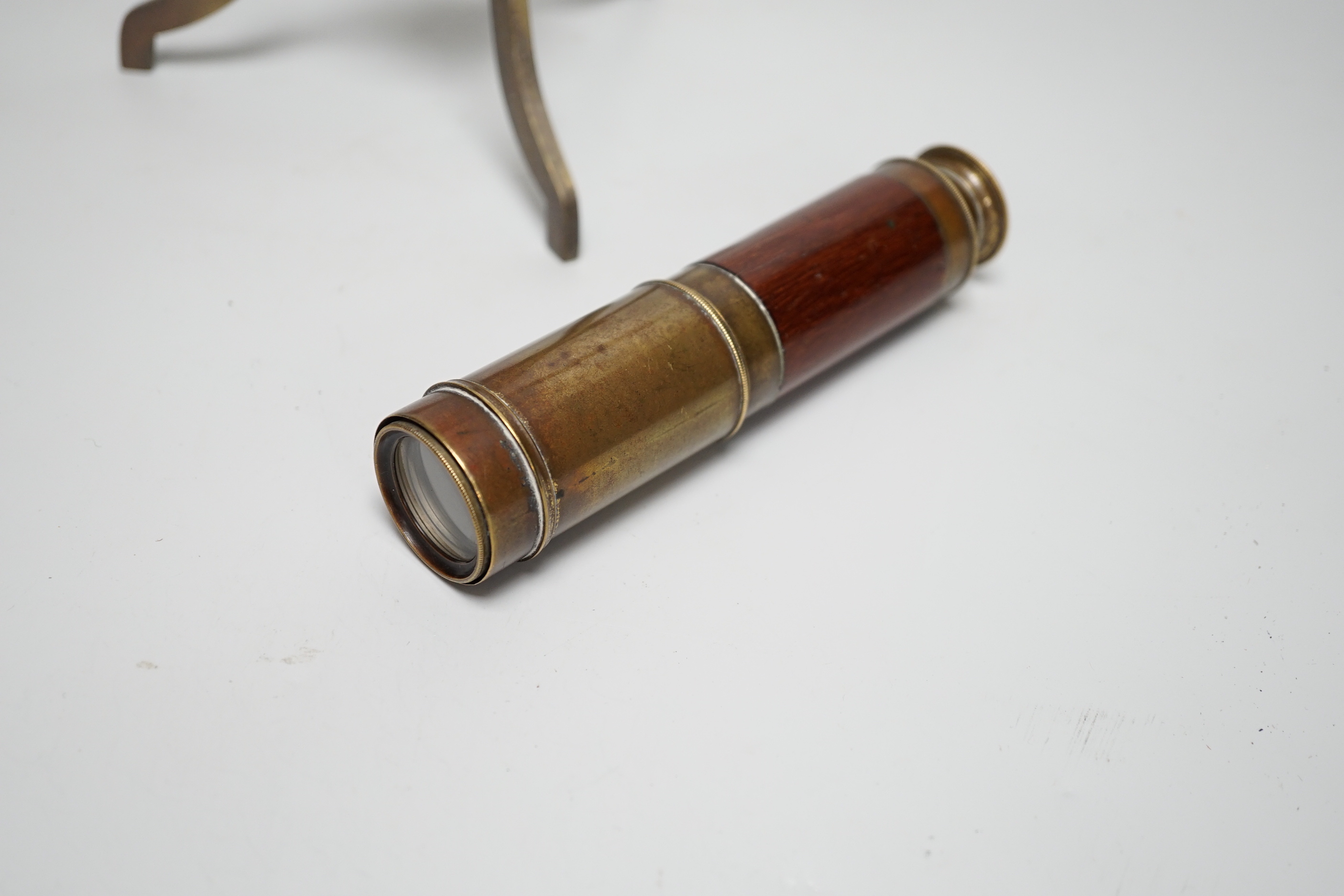 A brass telescope on tripod stand, signed Ottway, Ealing, 28cm high, together with a three-draw telescope